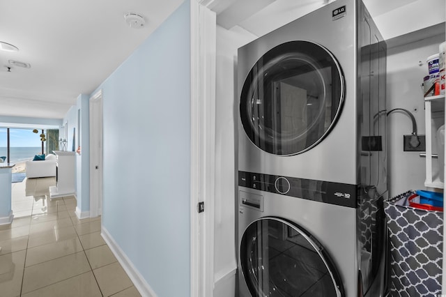 5511 N Ocean Blvd Unit 1801, Myrtle Beach, SC 29577 - laundry room with stacked washing machine and dryer and light tile patterned floors