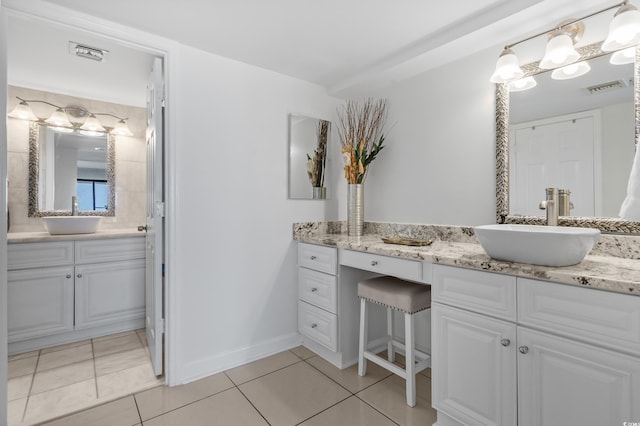 5511 N Ocean Blvd Unit 1801, Myrtle Beach, SC 29577 - full bathroom featuring two vanities and tile patterned floors