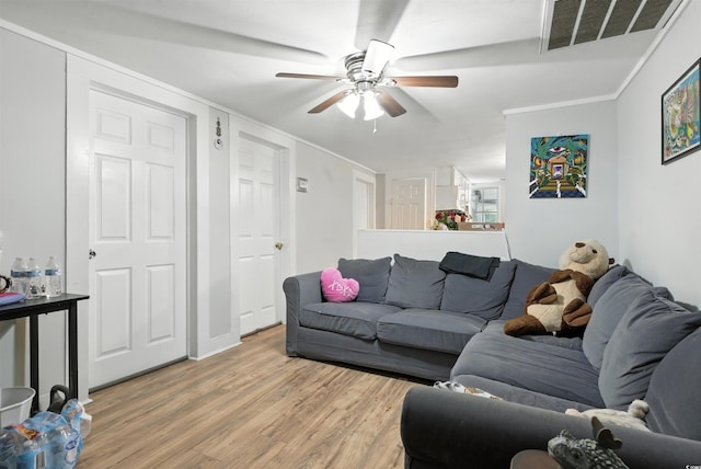 304 1st Ave N, Myrtle Beach, SC 29577 - living area with light wood-style flooring and ceiling fan