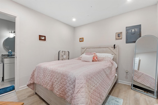 304 1st Ave N, Myrtle Beach, SC 29577 - bedroom with light wood-style floors, recessed lighting, and electric panel