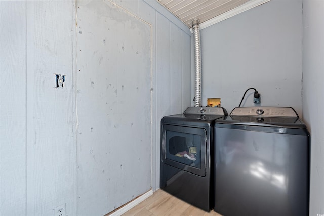 304 1st Ave N, Myrtle Beach, SC 29577 - laundry room featuring washer and clothes dryer, ornamental molding, and light wood-style floors