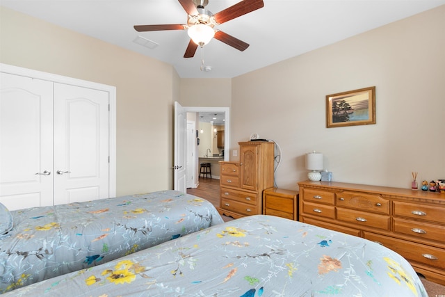 413 Goldenrod Cir Unit 2B, Little River, SC 29566 - bedroom with a closet and a ceiling fan