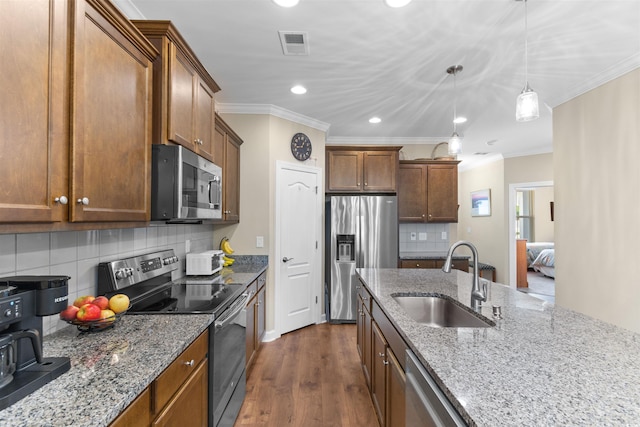 413 Goldenrod Cir Unit 2B, Little River, SC 29566 - kitchen with appliances with stainless steel finishes, recessed lighting, crown molding, decorative backsplash, and light stone counters
