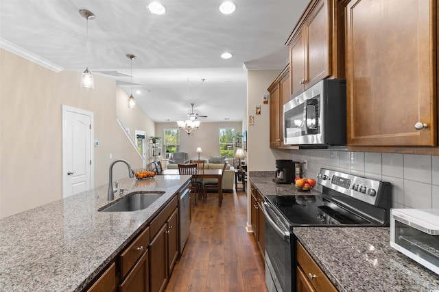 413 Goldenrod Cir Unit 2B, Little River, SC 29566 - kitchen featuring stainless steel appliances, recessed lighting, dark wood finished floors, backsplash, and dark stone countertops