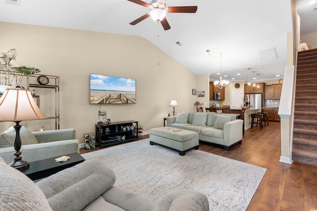 413 Goldenrod Cir Unit 2B, Little River, SC 29566 - living area featuring stairs, ceiling fan, lofted ceiling, a chandelier, and dark wood-style flooring