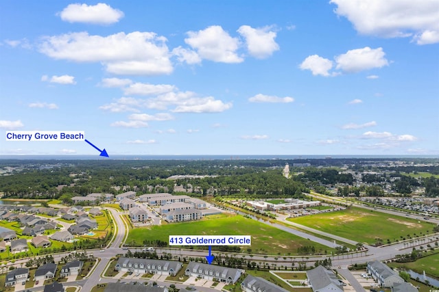 413 Goldenrod Cir Unit 2B, Little River, SC 29566 - aerial view of a nearby body of water and a tree filled landscape