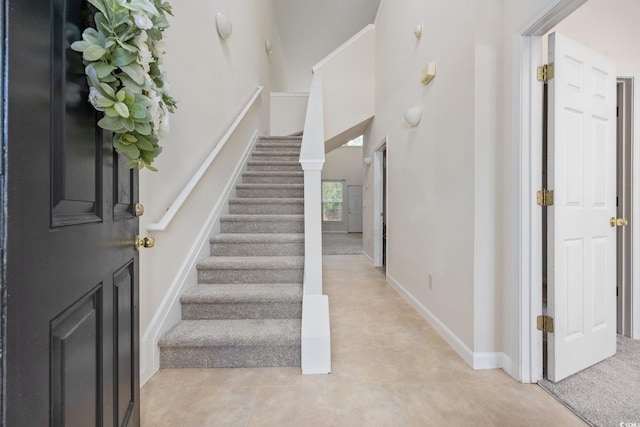 155 Chenoa Dr Unit E, Murrells Inlet, SC 29576 - stairs with baseboards and a towering ceiling