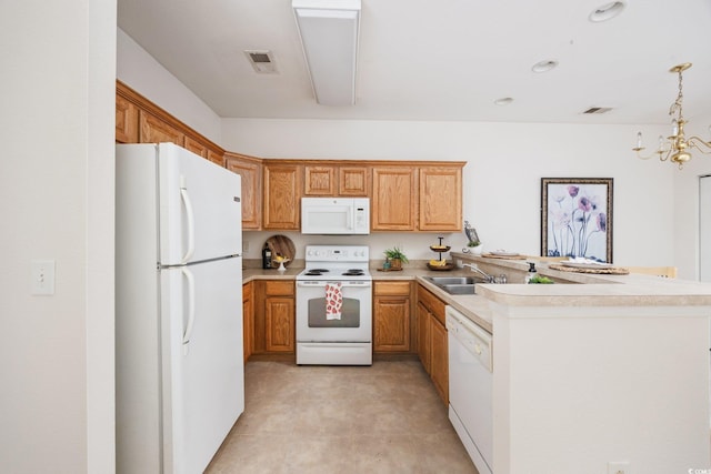 155 Chenoa Dr Unit E, Murrells Inlet, SC 29576 - kitchen with white appliances, a peninsula, light countertops, pendant lighting, and a chandelier