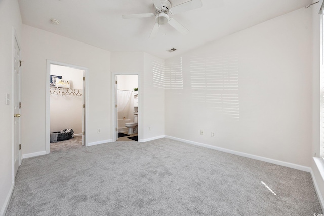 155 Chenoa Dr Unit E, Murrells Inlet, SC 29576 - unfurnished bedroom with carpet floors, a spacious closet, ensuite bath, a ceiling fan, and a closet