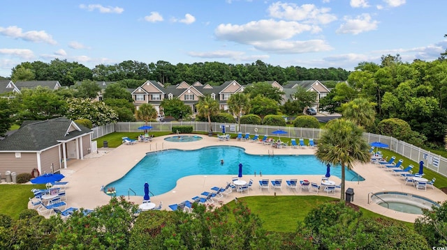 155 Chenoa Dr Unit E, Murrells Inlet, SC 29576 - community pool with a hot tub, a patio, and view of wooded area