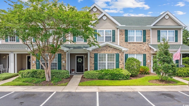 155 Chenoa Dr Unit E, Murrells Inlet, SC 29576 - view of property with uncovered parking, a shingled roof, and brick siding