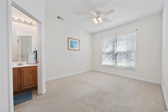 155 Chenoa Dr Unit D, Murrells Inlet, SC 29576 - unfurnished bedroom with light colored carpet, ensuite bath, and a ceiling fan