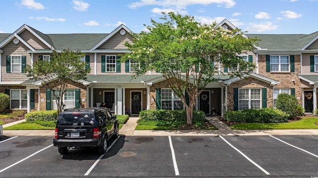 155 Chenoa Dr Unit D, Murrells Inlet, SC 29576 - view of property featuring brick siding, uncovered parking, and a shingled roof