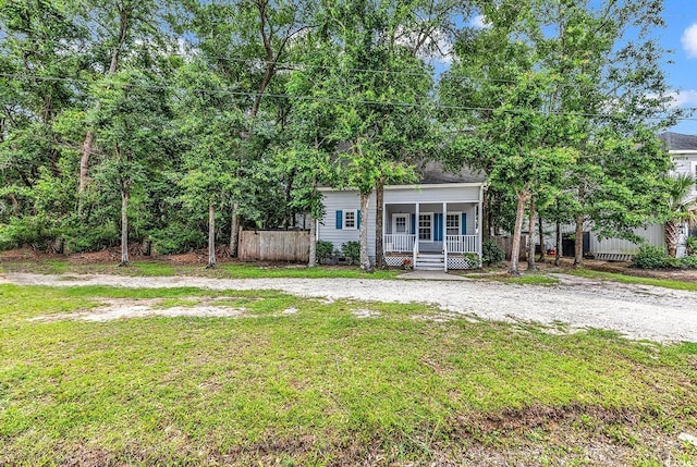 3969 Murrells Inlet Rd, Murrells Inlet, SC 29576 - obstructed view of property featuring covered porch and a front lawn