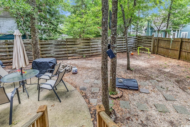 3969 Murrells Inlet Rd, Murrells Inlet, SC 29576 - fenced backyard featuring a patio area and area for grilling