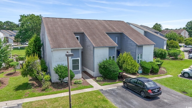 4049 Fairway Lakes Dr Unit 4049, Myrtle Beach, SC 29577 - view of front of property featuring a front yard, uncovered parking, and a shingled roof