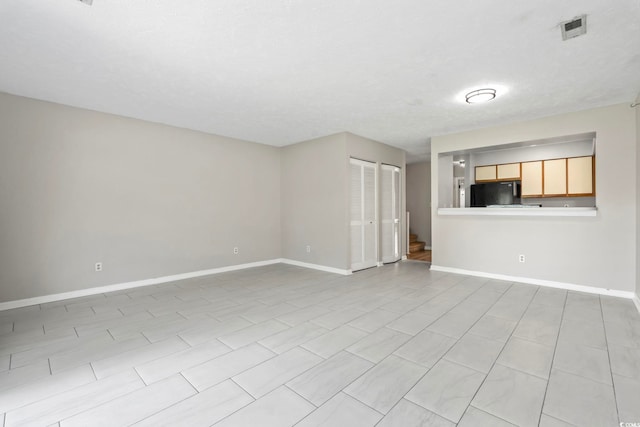 4049 Fairway Lakes Dr Unit 4049, Myrtle Beach, SC 29577 - unfurnished living room with baseboards and stairs