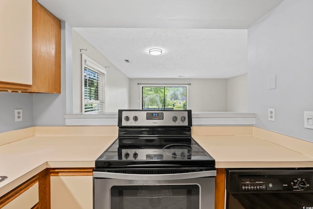 4049 Fairway Lakes Dr Unit 4049, Myrtle Beach, SC 29577 - kitchen featuring stainless steel electric stove, dishwasher, light countertops, and brown cabinets