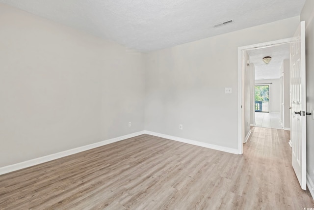 4049 Fairway Lakes Dr Unit 4049, Myrtle Beach, SC 29577 - spare room featuring a textured ceiling and light wood-style flooring