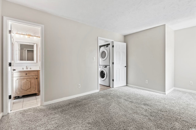 4049 Fairway Lakes Dr Unit 4049, Myrtle Beach, SC 29577 - washroom with stacked washer and clothes dryer and light carpet