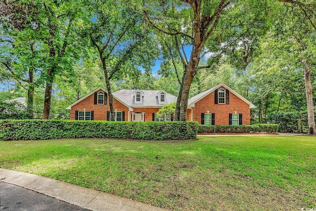 241 Black Duck Rd, Pawleys Island, SC 29585 - view of front of property featuring brick siding and a front yard