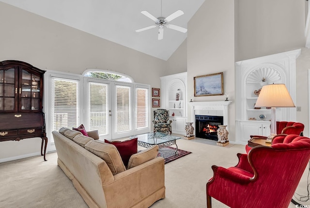 241 Black Duck Rd, Pawleys Island, SC 29585 - living area featuring high vaulted ceiling, carpet, a fireplace with flush hearth, a ceiling fan, and built in shelves