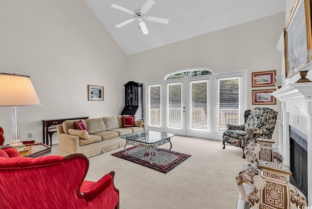 241 Black Duck Rd, Pawleys Island, SC 29585 - living area with high vaulted ceiling, a fireplace, carpet, ceiling fan, and french doors