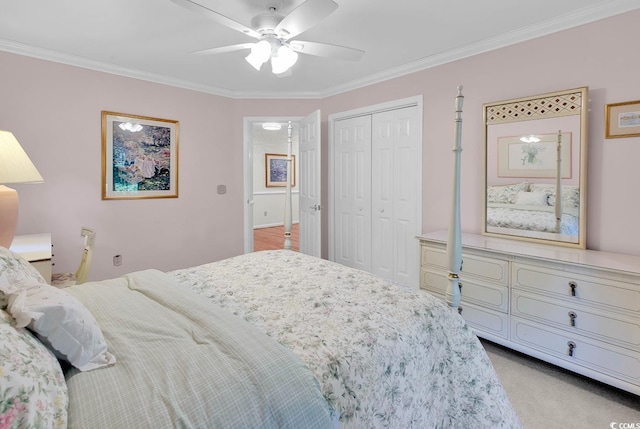 241 Black Duck Rd, Pawleys Island, SC 29585 - bedroom with crown molding, a closet, a ceiling fan, and light colored carpet