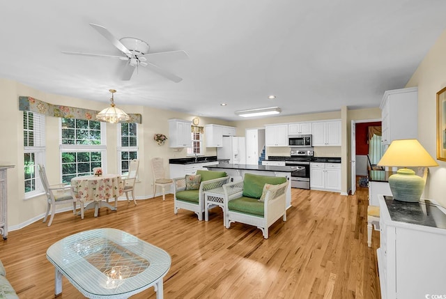 241 Black Duck Rd, Pawleys Island, SC 29585 - living area featuring light wood finished floors, ceiling fan, and recessed lighting