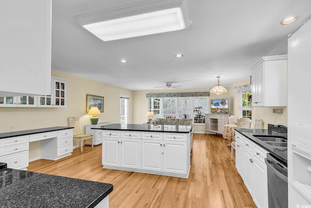 241 Black Duck Rd, Pawleys Island, SC 29585 - kitchen with dishwasher, dark countertops, plenty of natural light, recessed lighting, and light wood-type flooring