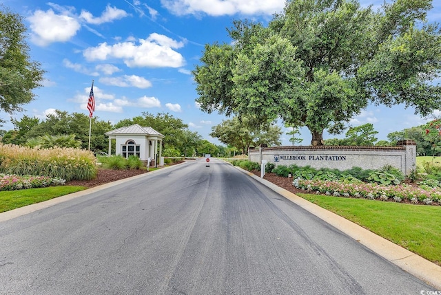241 Black Duck Rd, Pawleys Island, SC 29585 - view of asphalt road featuring a gated entry