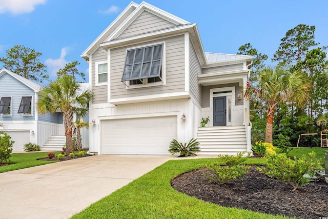 277 Splendor Cir, Murrells Inlet, SC 29576 - view of front of property with a garage, concrete driveway, a metal roof, and board and batten siding