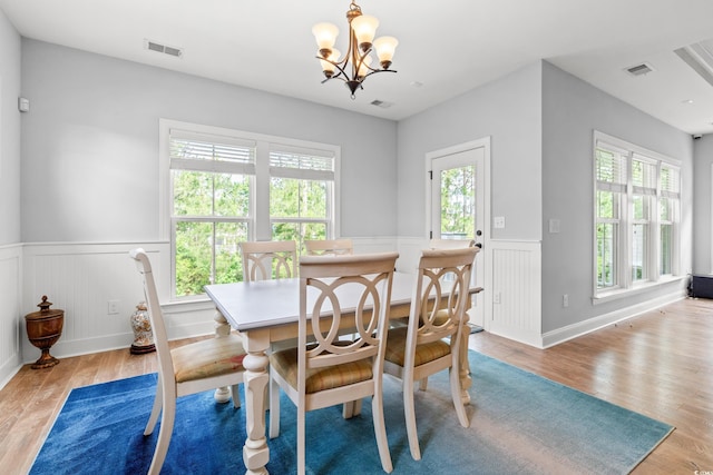 277 Splendor Cir, Murrells Inlet, SC 29576 - dining room with a wainscoted wall, healthy amount of natural light, light wood finished floors, and a chandelier