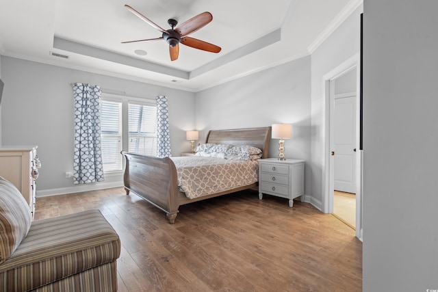 277 Splendor Cir, Murrells Inlet, SC 29576 - bedroom with a raised ceiling, hardwood / wood-style floors, crown molding, and a ceiling fan