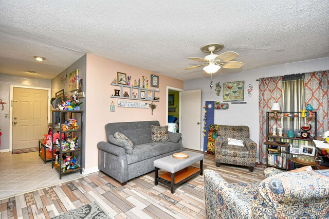 1025 Plantation Dr Unit 2413/2414, Little River, SC 29566 - living room with ceiling fan, a textured ceiling, and light wood finished floors
