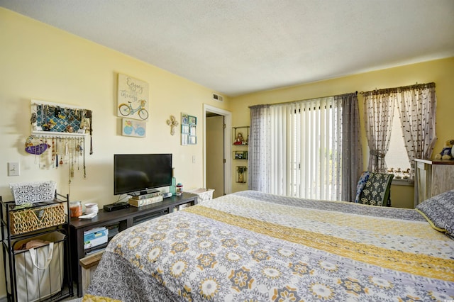 1025 Plantation Dr Unit 2413/2414, Little River, SC 29566 - bedroom featuring a textured ceiling