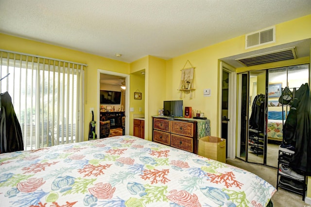 1025 Plantation Dr Unit 2413/2414, Little River, SC 29566 - carpeted bedroom with a textured ceiling and a closet