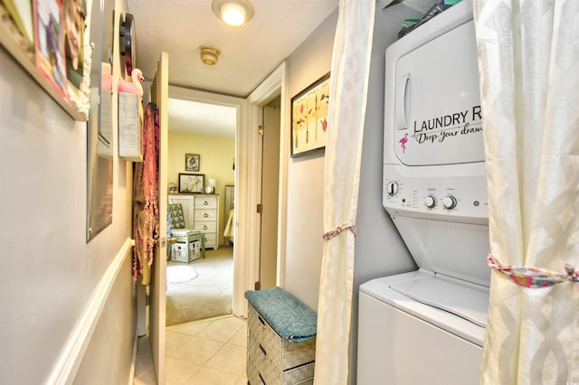 1025 Plantation Dr Unit 2413/2414, Little River, SC 29566 - laundry area featuring stacked washer and clothes dryer and light tile patterned flooring