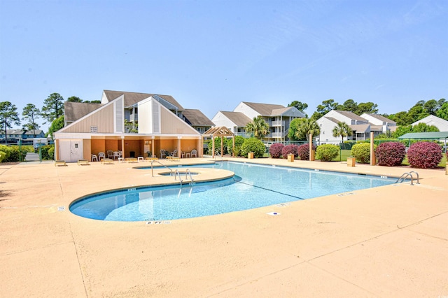 1025 Plantation Dr Unit 2413/2414, Little River, SC 29566 - community pool with a patio area and a residential view