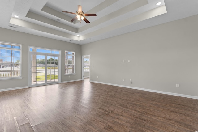 347 Leste Rd, Myrtle Beach, SC 29588 - spare room featuring a tray ceiling, dark wood-style flooring, ceiling fan, recessed lighting, and a high ceiling
