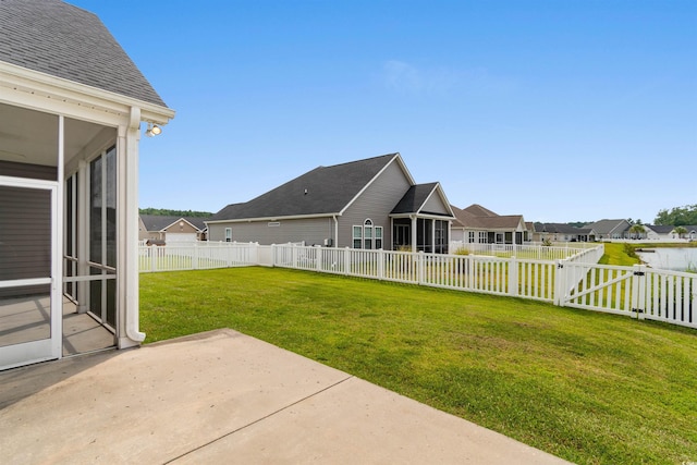 347 Leste Rd, Myrtle Beach, SC 29588 - fenced backyard featuring a sunroom, a patio area, a residential view, and a gate