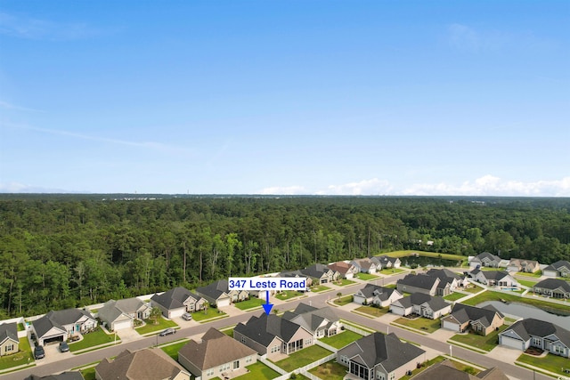 347 Leste Rd, Myrtle Beach, SC 29588 - aerial perspective of suburban area with a heavily wooded area