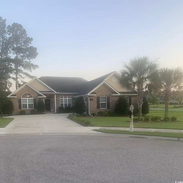 1009 Maccoa Dr, Conway, SC 29526 - view of front of house with a lawn, brick siding, and driveway