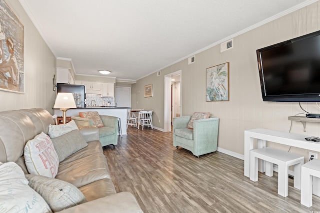 5601 N Ocean Blvd Unit B-314, Myrtle Beach, SC 29577 - living room with ornamental molding and light wood-type flooring