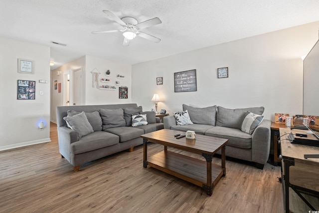 1311 Turkey Ridge Rd Unit A, Surfside Beach, SC 29575 - living area with light wood-style floors, a ceiling fan, and a textured ceiling
