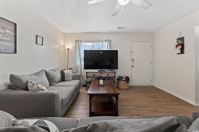 1311 Turkey Ridge Rd Unit A, Surfside Beach, SC 29575 - living room with wood finished floors, a ceiling fan, and a textured ceiling
