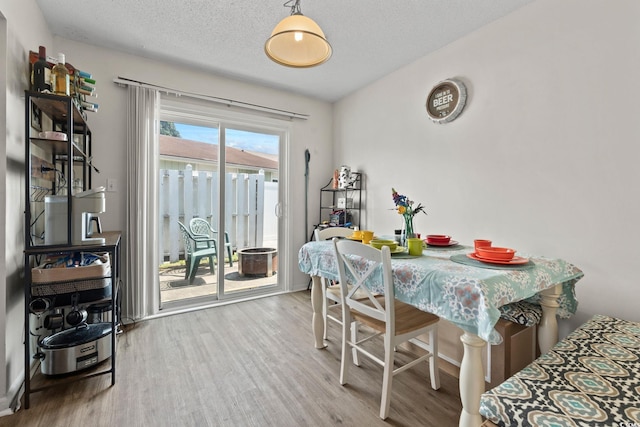 1311 Turkey Ridge Rd Unit A, Surfside Beach, SC 29575 - dining space with wood finished floors and a textured ceiling