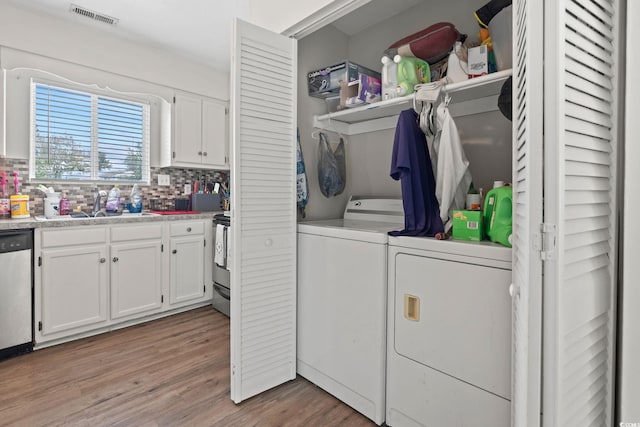 1311 Turkey Ridge Rd Unit A, Surfside Beach, SC 29575 - washroom featuring separate washer and dryer and light wood-style flooring