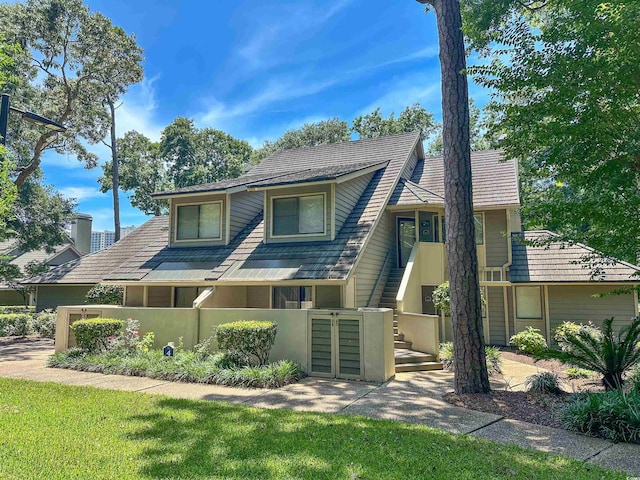145 Hartland Dr Unit 4-E, Myrtle Beach, SC 29572 - view of front of house with a fenced front yard, a gate, and stucco siding