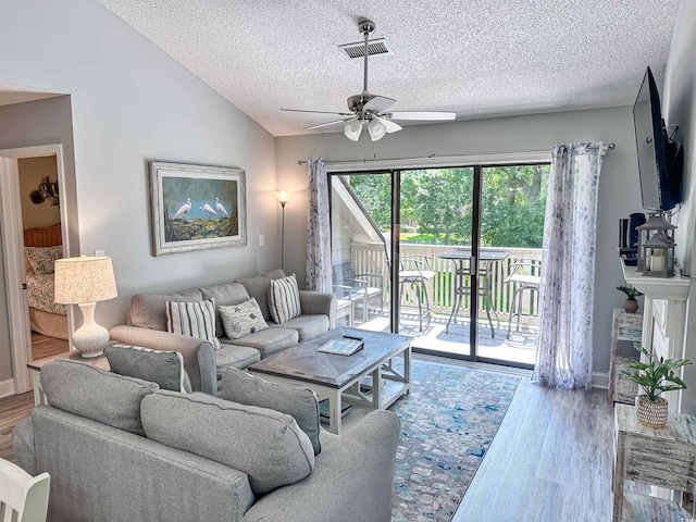 145 Hartland Dr Unit 4-E, Myrtle Beach, SC 29572 - living room with a textured ceiling, a ceiling fan, wood finished floors, and vaulted ceiling